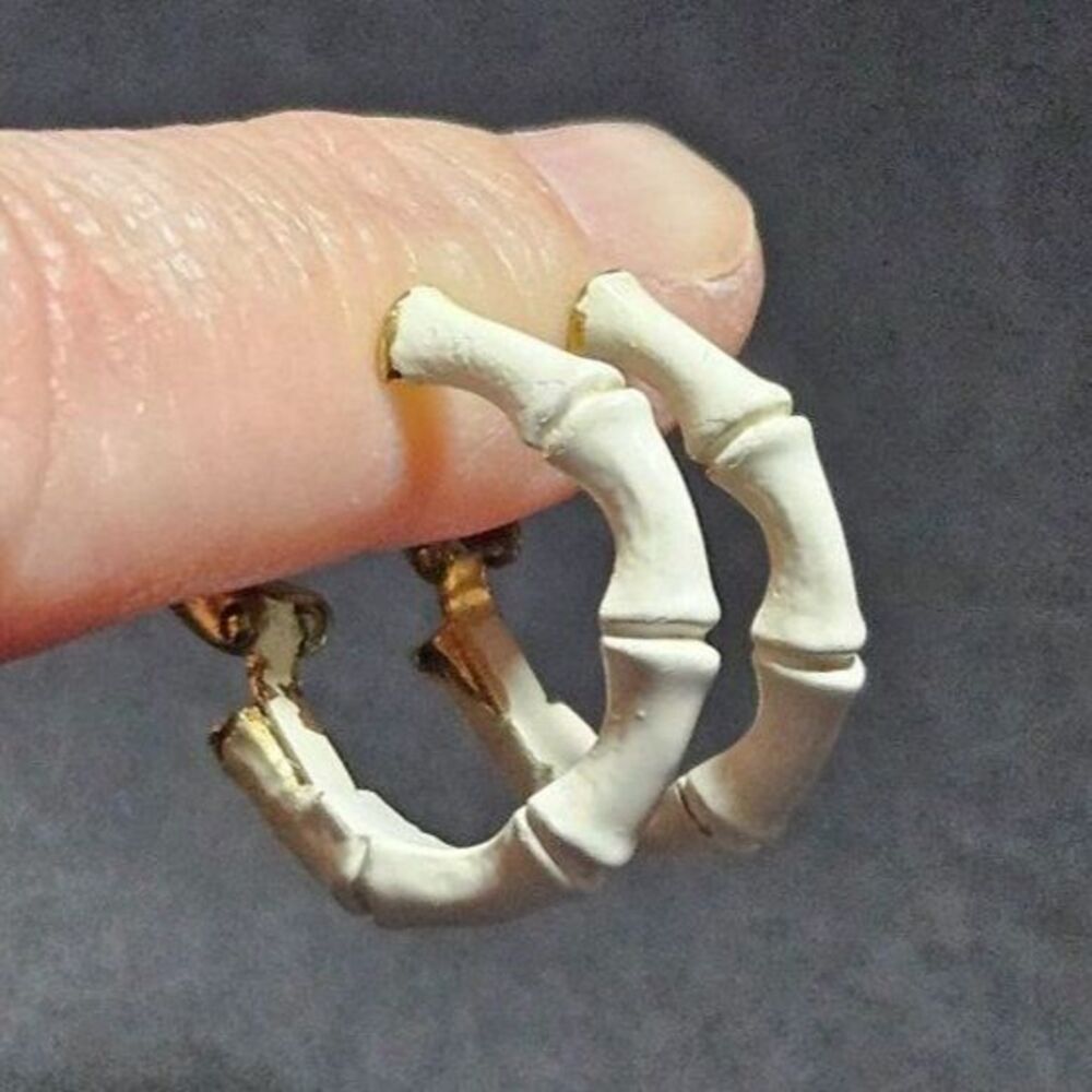 Crown Trifari gold tone and white clip on hoop earrings